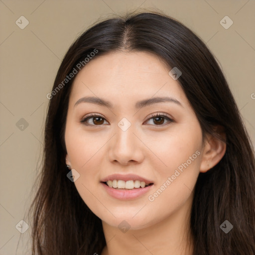 Joyful asian young-adult female with long  brown hair and brown eyes