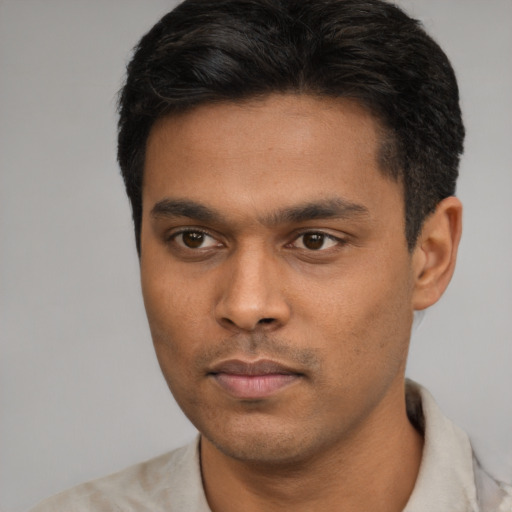 Neutral latino young-adult male with short  black hair and brown eyes