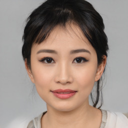 Joyful asian young-adult female with medium  black hair and brown eyes