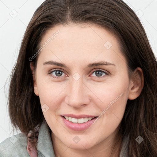 Joyful white young-adult female with long  brown hair and grey eyes