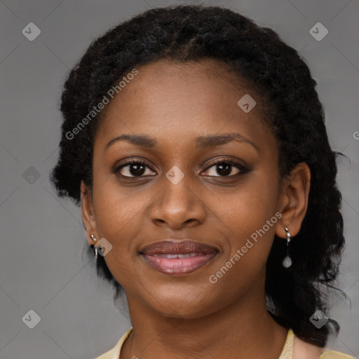 Joyful black young-adult female with medium  brown hair and brown eyes