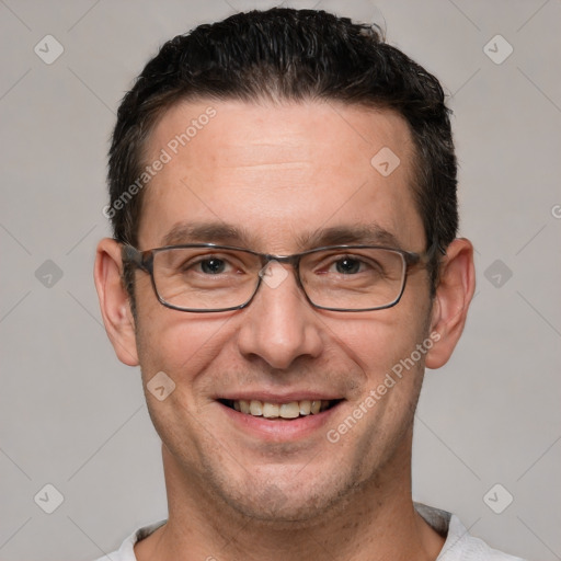 Joyful white adult male with short  brown hair and brown eyes