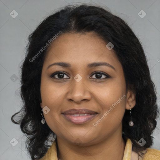 Joyful black young-adult female with long  brown hair and brown eyes