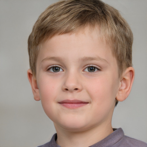 Joyful white child male with short  brown hair and brown eyes