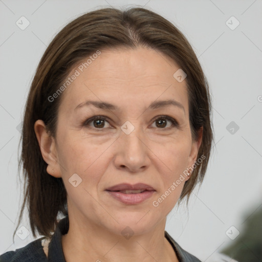 Joyful white adult female with medium  brown hair and brown eyes