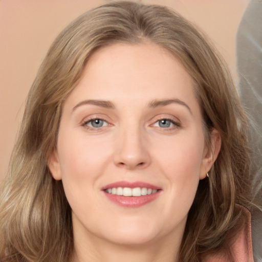 Joyful white young-adult female with long  brown hair and grey eyes