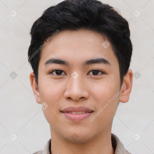 Joyful asian young-adult male with short  brown hair and brown eyes