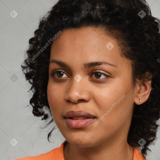 Joyful black young-adult female with medium  black hair and brown eyes