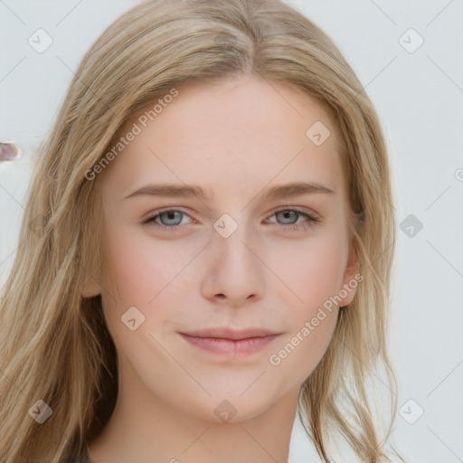 Joyful white young-adult female with long  brown hair and blue eyes