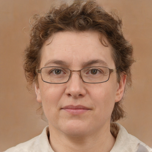 Joyful white adult female with short  brown hair and green eyes