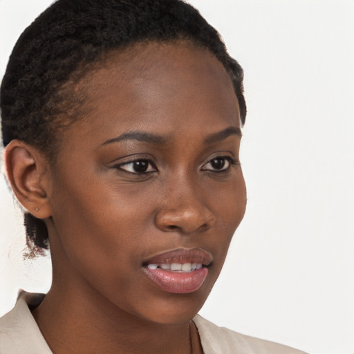 Joyful black young-adult female with short  brown hair and brown eyes