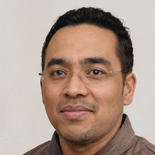 Neutral latino adult male with short  black hair and brown eyes