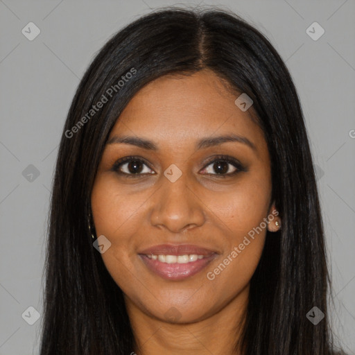 Joyful black young-adult female with long  brown hair and brown eyes