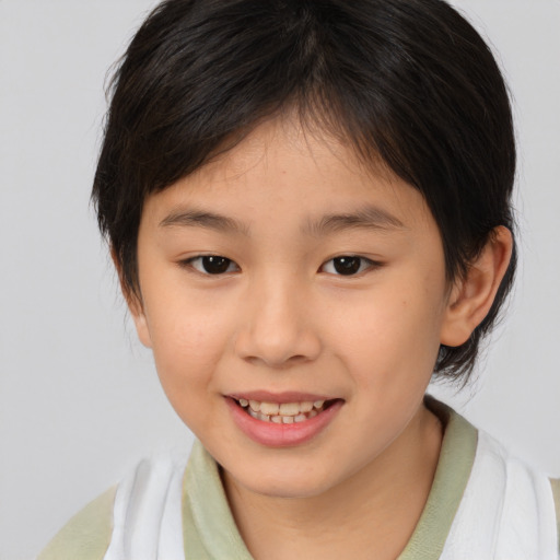 Joyful asian child female with medium  brown hair and brown eyes