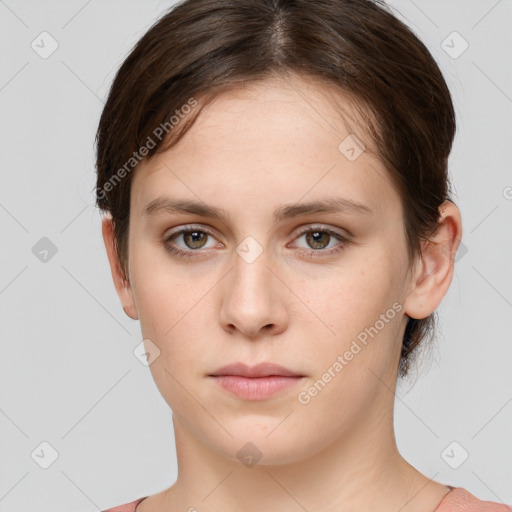 Neutral white young-adult female with short  brown hair and grey eyes