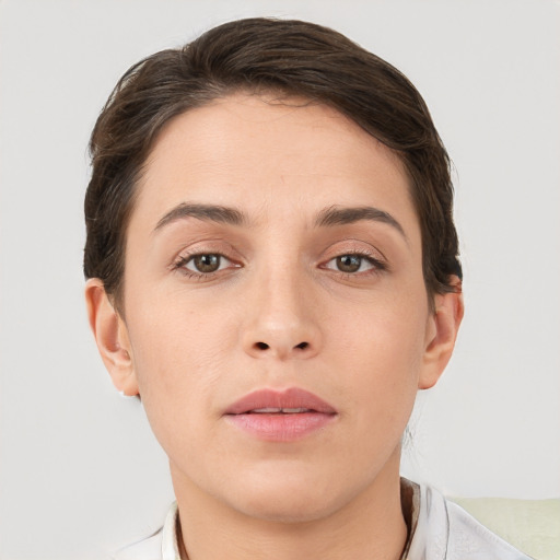 Neutral white young-adult female with short  brown hair and brown eyes