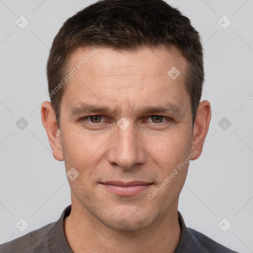 Joyful white adult male with short  brown hair and brown eyes