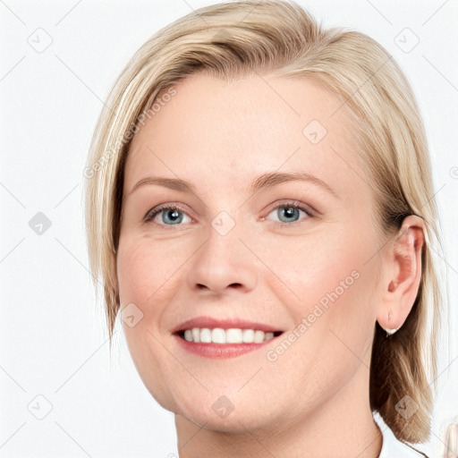 Joyful white young-adult female with medium  brown hair and blue eyes