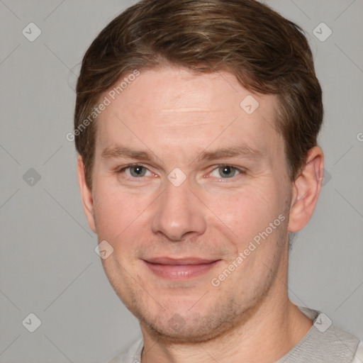 Joyful white adult male with short  brown hair and grey eyes