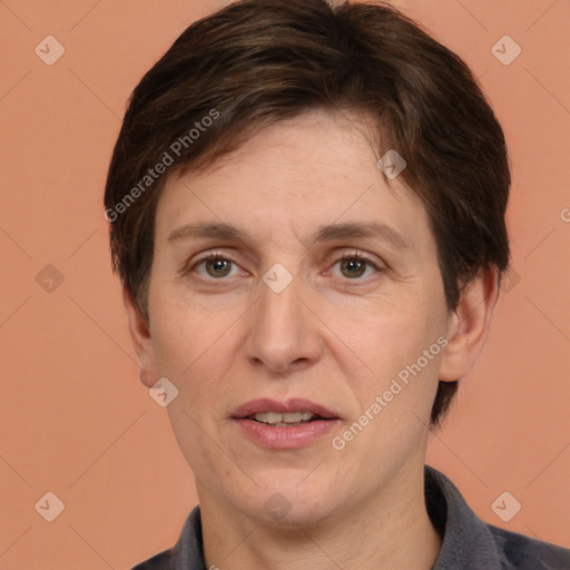 Joyful white adult female with short  brown hair and brown eyes