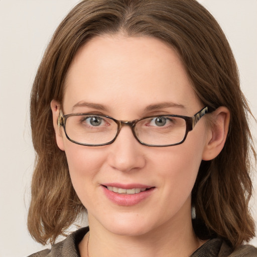 Joyful white young-adult female with medium  brown hair and blue eyes