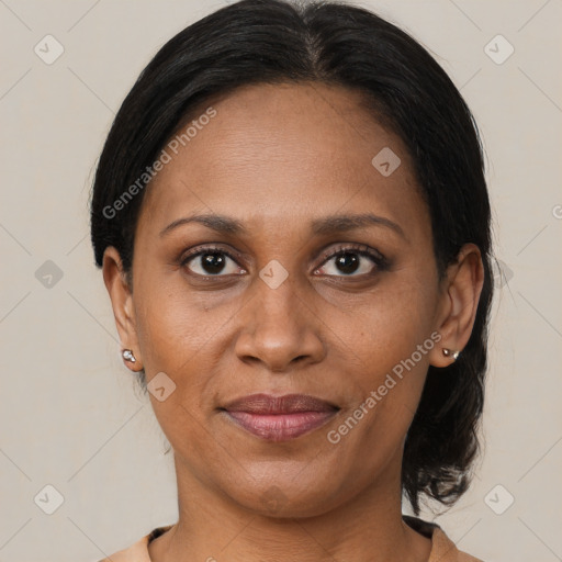 Joyful latino adult female with medium  brown hair and brown eyes