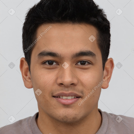 Joyful latino young-adult male with short  brown hair and brown eyes