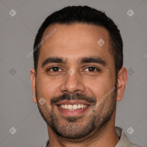 Joyful white young-adult male with short  black hair and brown eyes