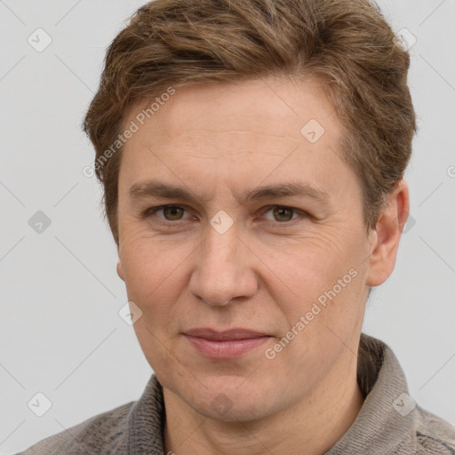 Joyful white adult male with short  brown hair and grey eyes