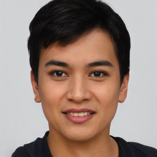 Joyful asian young-adult male with short  brown hair and brown eyes