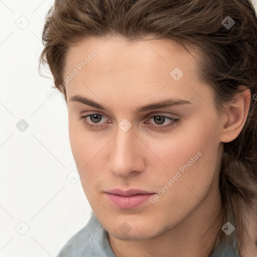 Neutral white young-adult female with long  brown hair and brown eyes