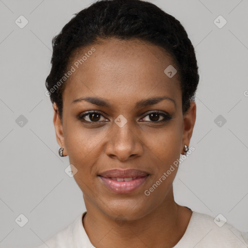 Joyful black young-adult female with short  black hair and brown eyes