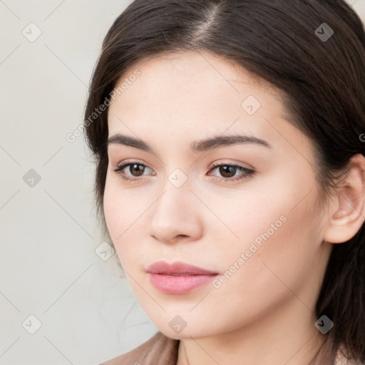 Neutral white young-adult female with long  brown hair and brown eyes