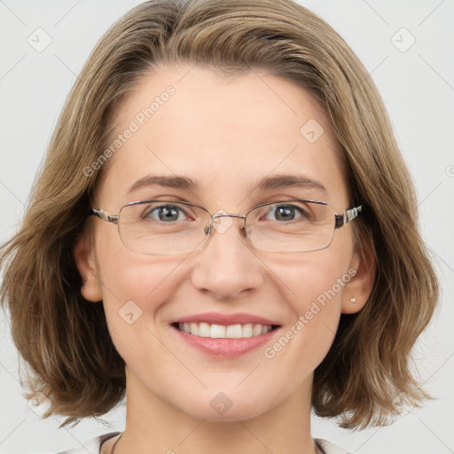 Joyful white adult female with medium  brown hair and blue eyes