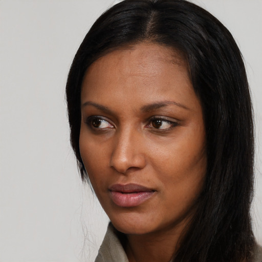 Neutral black young-adult female with long  black hair and brown eyes