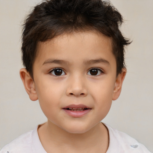 Joyful white child male with short  brown hair and brown eyes