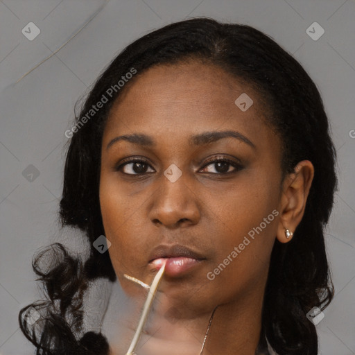 Neutral black young-adult female with long  black hair and brown eyes