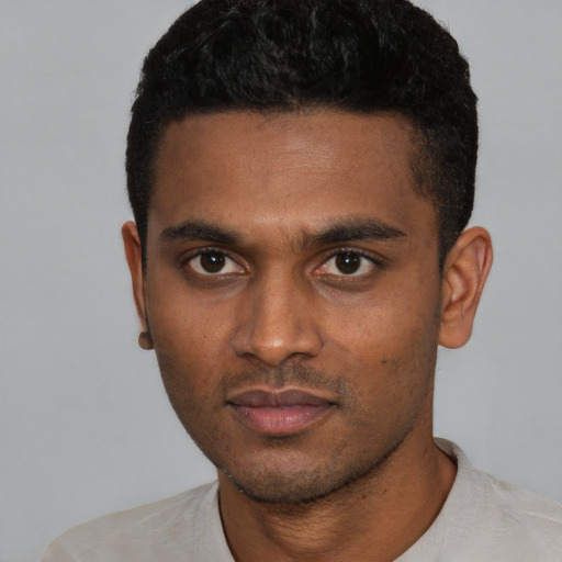 Neutral black young-adult male with short  black hair and brown eyes