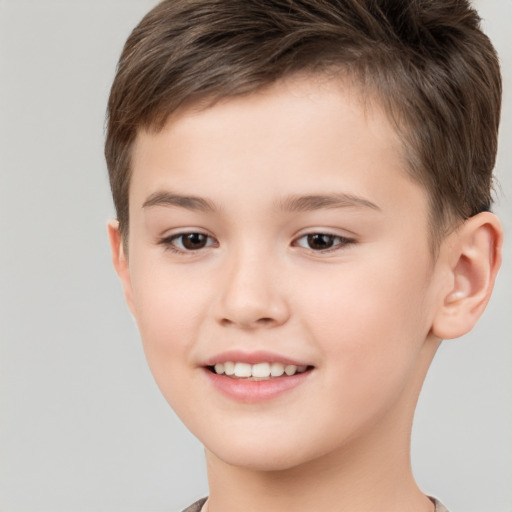 Joyful white child male with short  brown hair and brown eyes