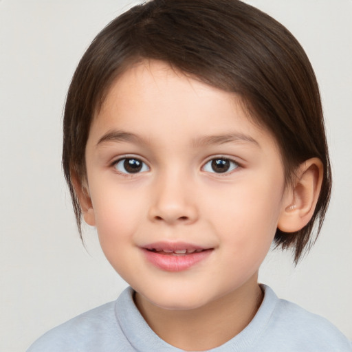 Joyful white child female with medium  brown hair and brown eyes