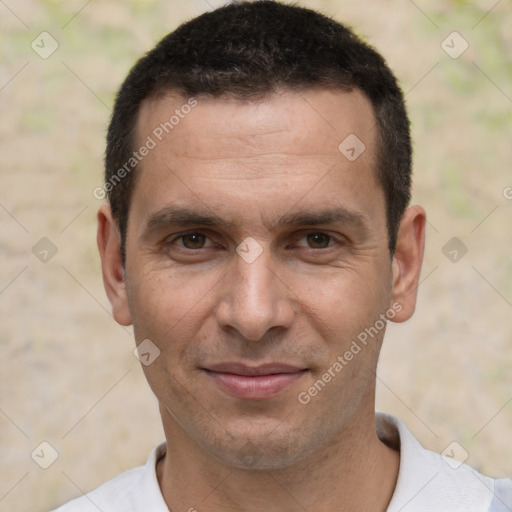 Joyful white adult male with short  brown hair and brown eyes