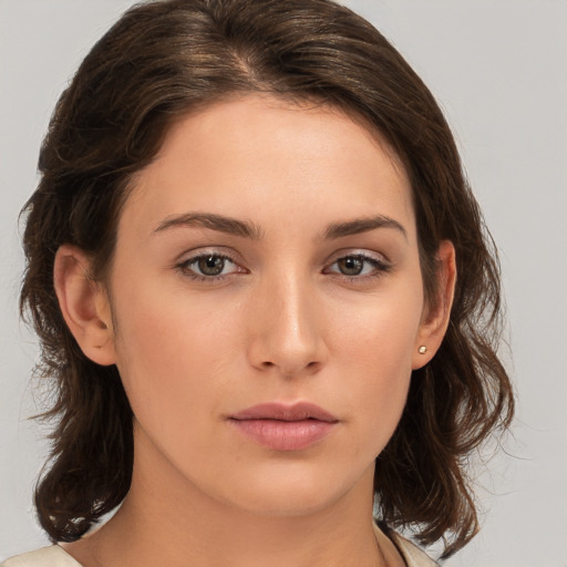 Neutral white young-adult female with medium  brown hair and brown eyes