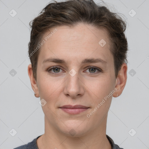 Joyful white young-adult female with short  brown hair and grey eyes