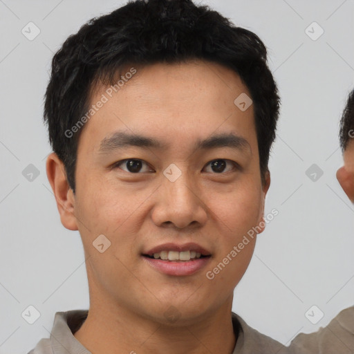 Joyful asian young-adult male with short  black hair and brown eyes