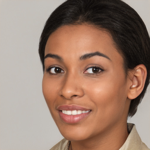 Joyful latino young-adult female with long  brown hair and brown eyes