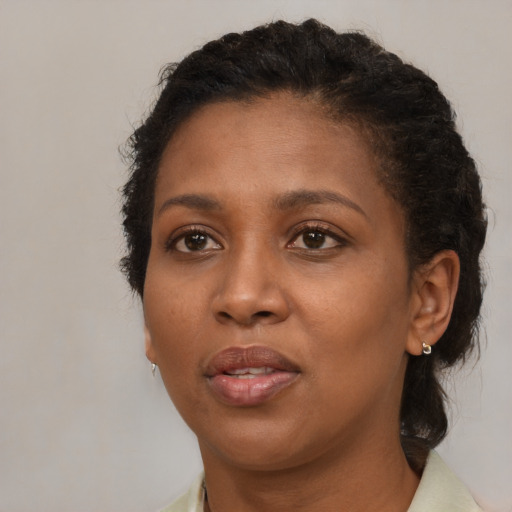 Neutral black adult female with medium  brown hair and brown eyes