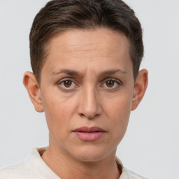 Joyful white adult female with short  brown hair and brown eyes