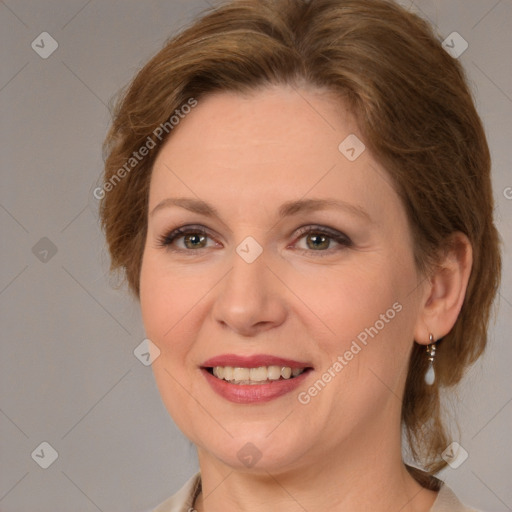 Joyful white adult female with medium  brown hair and brown eyes