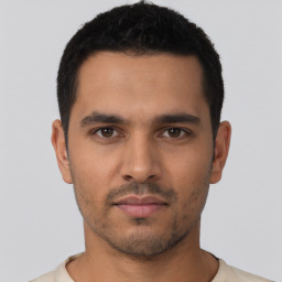 Neutral latino young-adult male with short  black hair and brown eyes