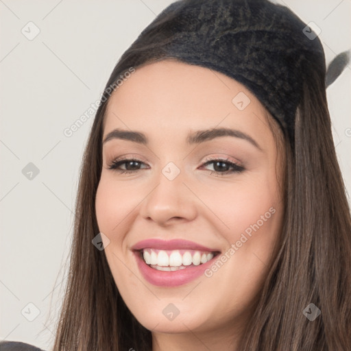 Joyful white young-adult female with long  black hair and brown eyes